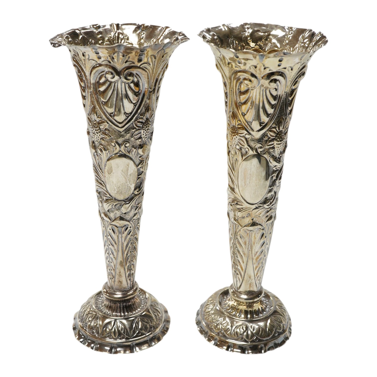 A pair of late Victorian repousse silver trumpet vase, Charles Boyton II, London, 1892/3, 20.3cm, weighted. Condition - poor